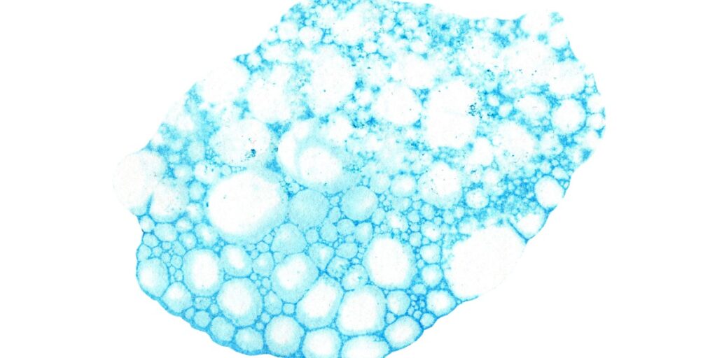 Blue watercolor painting with bubbles mimicking toluidine blue stain