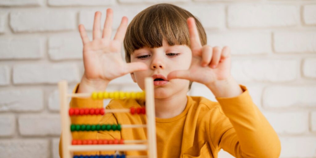 Image of a child counting using an abacus denoting the ease of counting cells using a hemocytometer