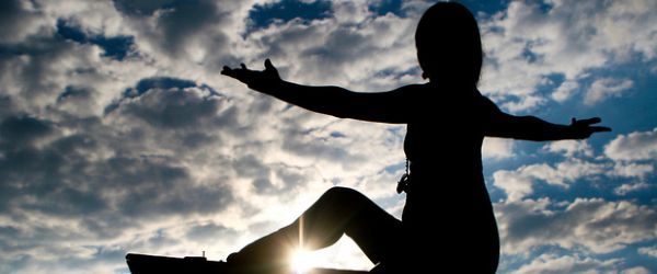 An image of a person doing yoga to depict wellness as a scientist.