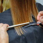 A person having their hair cut with straight edges to illustrate blunt-end cloning