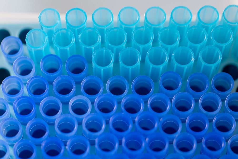 Image of someone filling vials with pipettes to represent successful postdoctoral interview preparation