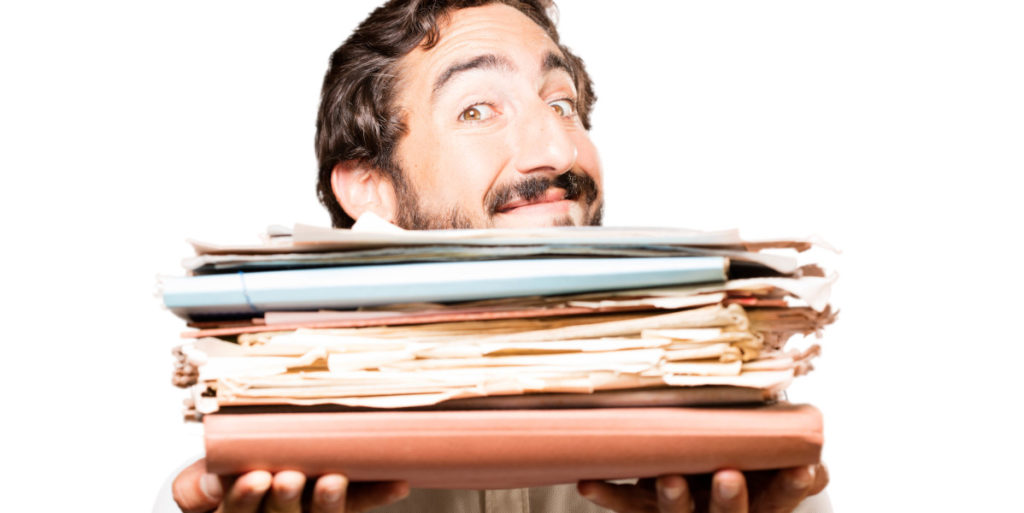 Man holding papers representing all work to be published