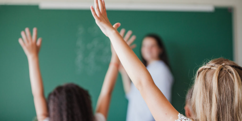 School children and teacher depicting the role of a mentor