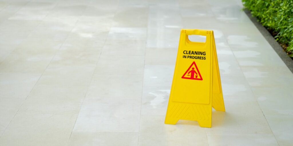 Yellow 'Cleaning in Progress' floor sign to represent effective laboratory sterilization methods