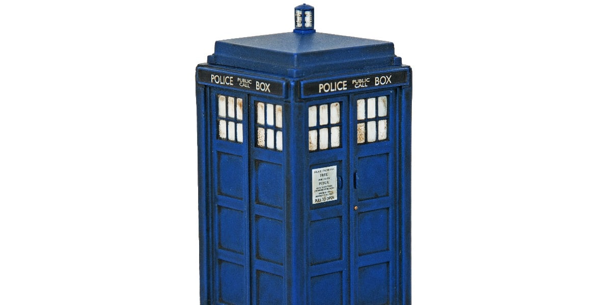 A model of Dr Who's police box Tardis on a white background to represent ways to use your Dr title for good and evil