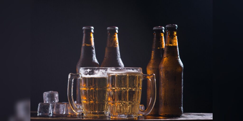 An image of beer bottles and mugs denoting ethanol used for ethanol precipitation