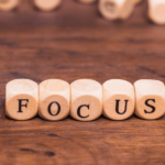 The word "focus" written one wooden blocks to emphasize isoelectric focusing