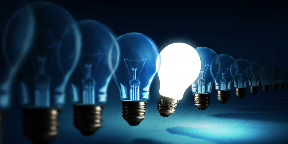 Lightbulbs on a blue background representing the blue colour of Laemmli buffer and learning