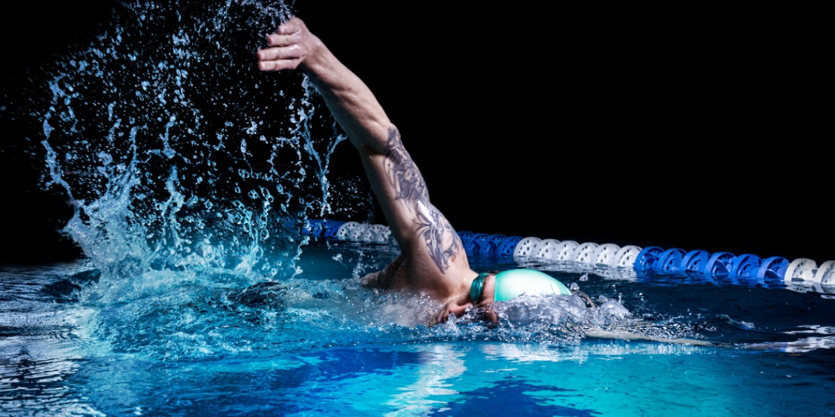 An image of a male swimming front crawl to represent the Pubcrawler tool