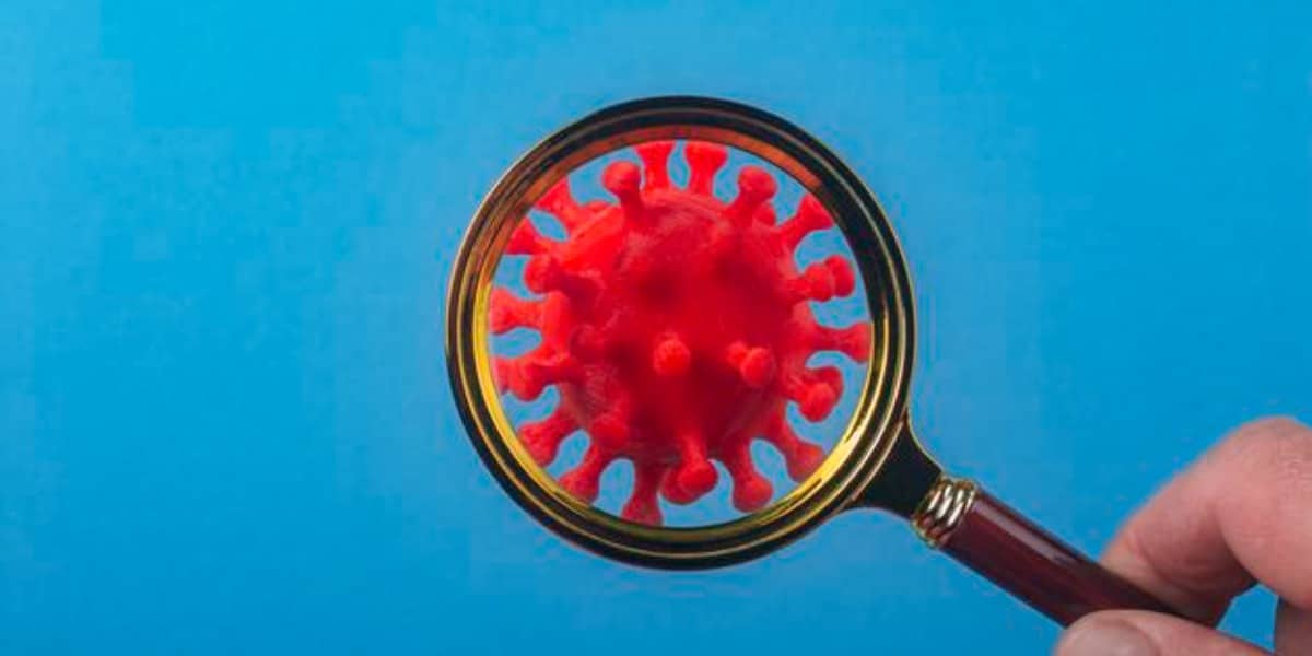 Virus under magnifying glass representing counting viruses using flow virometry