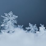 An image of snow crystals to depict protein crystallization seeding