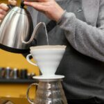 Coffee being poured through a filter to demonstrate filtration