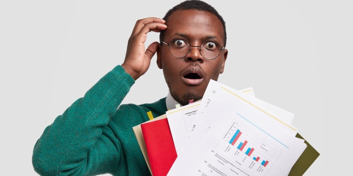 Man holding papers representing peer review in science