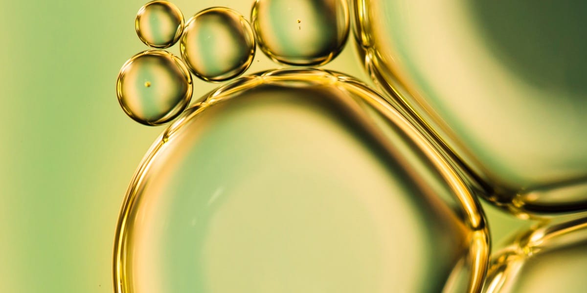 Oil droplets to depict the use of oil in oil immersion microscopy