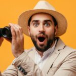 Shocked man with binoculars to represent the surprise when researchers learn what CRISPR cas13 can do