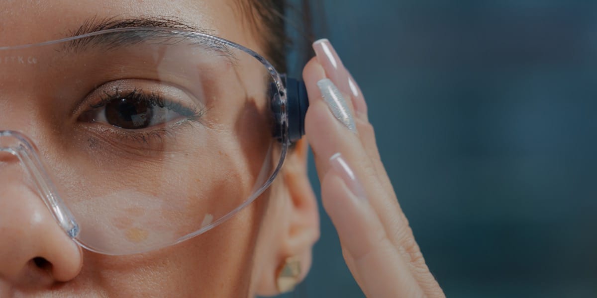 woman wearing safety glasses to depict different ppe for face