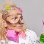 A girl looking at chemicals with explosion residue on her face because she didn't read the safety data sheet