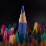 A selection of colored pencils representing spectral unmixing in flow cytometry.