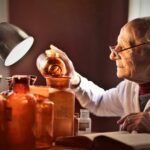 A chemistry professor checking which reagents are usable past their chemical expiry dates.