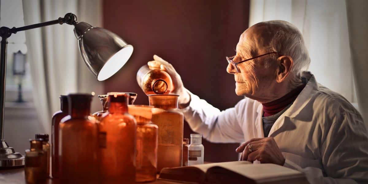 A chemistry professor checking which reagents are usable past their chemical expiry dates.