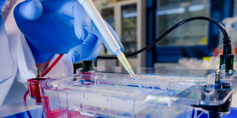 Scientist using pipette in lab