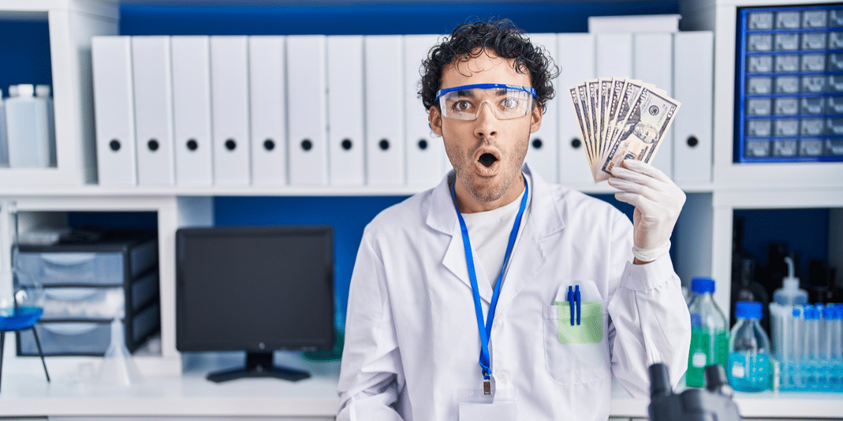 Surprised scientist holding cash