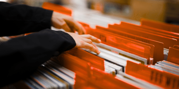 Hands sorting through file folders