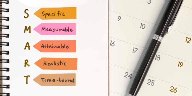 SMART goals with calendar and pen